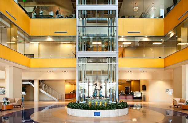 building ground floor with view of elevator and all floors