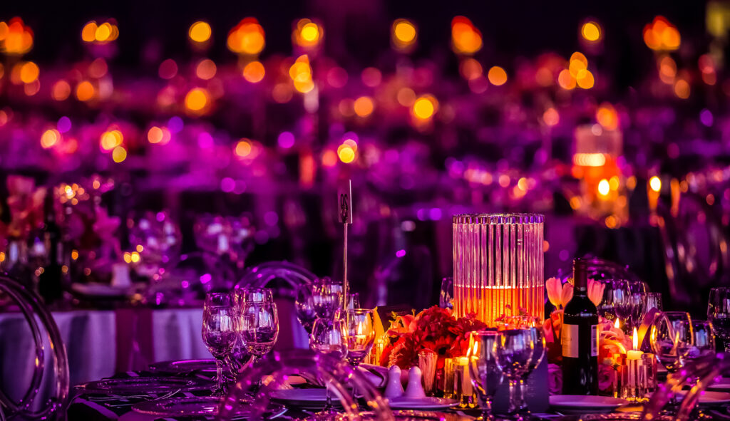 A pink and purple event with yellow and orange lighting that is completely saturated. 