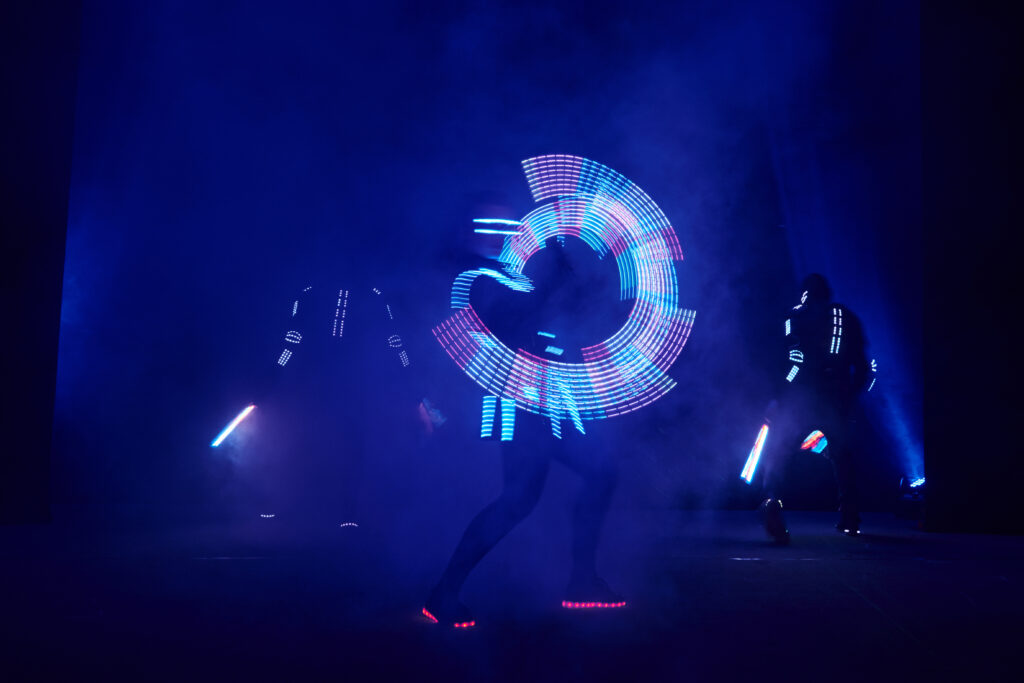 Laser show performance, dancers in led suits with LED lamp, very beautiful event entertainment performance.