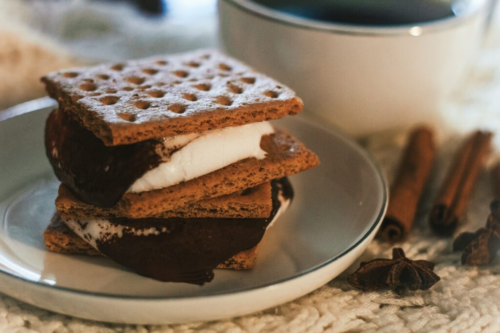 Close up photo of s'mores and hot cocoa from a s'mores bar at a holiday party